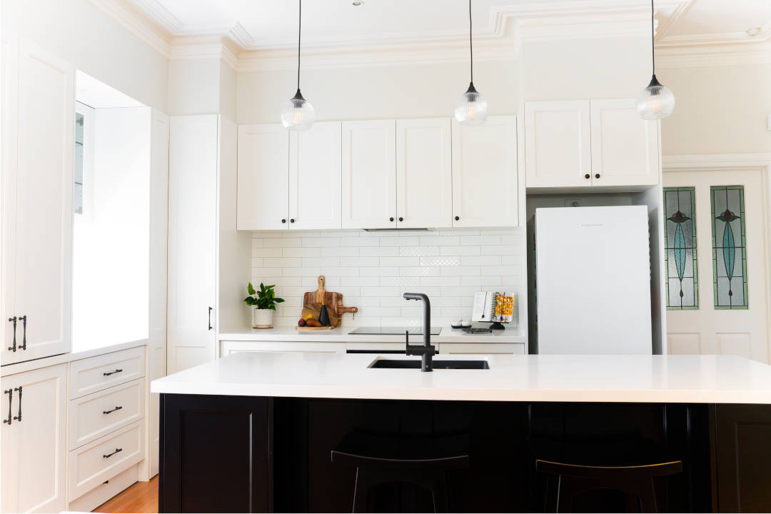 MKB34_Direct kitchens_black cabinetry_white overhead cbainets_black tap Finewood Designer Kitchens